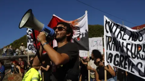 Nationwide Strikes Erupt Against Spending Slashing